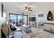 Cozy living room with neutral decor and access to a private balcony at 1500 Park Beach Cir # 2F, Punta Gorda, FL 33950