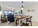Bright living area with a wooden dining table, nautical décor, and stunning views at 1500 Park Beach Cir # 2F, Punta Gorda, FL 33950