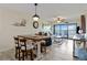 Open-concept design with living room flowing into dining area, filled with natural light at 1500 Park Beach Cir # 2F, Punta Gorda, FL 33950