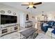 Cozy living room features stylish décor, a ceiling fan, and tile flooring throughout the open space at 1500 Park Beach Cir # 2F, Punta Gorda, FL 33950
