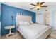 Inviting bedroom with blue decor, offering a peaceful retreat with ample natural light and tile floors at 1500 Park Beach Cir # 2F, Punta Gorda, FL 33950