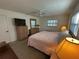 Relaxing bedroom with natural light, ceiling fan, and neutral tones create a cozy atmosphere at 1505 Kenmore St, Port Charlotte, FL 33952
