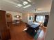 Spacious dining area with hardwood floors, classic decor, and abundant natural light at 1505 Kenmore St, Port Charlotte, FL 33952