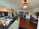 Bright dining room with wood floors, classic chandelier, and elegant decor at 1505 Kenmore St, Port Charlotte, FL 33952