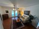Inviting living room with french doors leading to the outdoor space, filled with light at 1505 Kenmore St, Port Charlotte, FL 33952