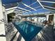 Pool with enclosure offers space to enjoy the outdoors in the beautiful sun at 1505 Kenmore St, Port Charlotte, FL 33952