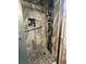 Modern tiled shower with built-in niche for storage and a convenient grab bar at 1505 Kenmore St, Port Charlotte, FL 33952