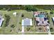 Aerial view of home, adjacent lot, and canal showing proximity and nearby homesites at 1596 Hayworth Rd, Port Charlotte, FL 33952