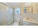 Well-lit bathroom featuring a walk-in shower and vanity at 1596 Hayworth Rd, Port Charlotte, FL 33952
