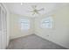 Simple bedroom with a ceiling fan and white carpet at 1596 Hayworth Rd, Port Charlotte, FL 33952