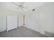 Comfortable bedroom features carpet, ceiling fan, and ensuite bathroom access at 1596 Hayworth Rd, Port Charlotte, FL 33952
