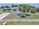 Charming home with a quaint white picket fence and lush landscaping at 1596 Hayworth Rd, Port Charlotte, FL 33952