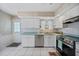 Cozy kitchen features modern appliances, ample counter space, and access to the outdoors at 1596 Hayworth Rd, Port Charlotte, FL 33952