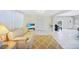 Bright living room with a comfortable sofa, piano, and neutral decor at 1596 Hayworth Rd, Port Charlotte, FL 33952