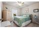 A bedroom with a large bed, a wicker dresser, and a window at 16032 Galiano Ct, Punta Gorda, FL 33955