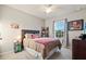 Cozy bedroom with a ceiling fan, natural light and tasteful decor creating a comfortable personal space at 16032 Galiano Ct, Punta Gorda, FL 33955
