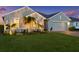 Beautiful home featuring a manicured lawn and mature landscaping at 16032 Galiano Ct, Punta Gorda, FL 33955