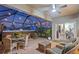 Relaxing screened-in patio with a hot tub and comfortable wicker seating at 16032 Galiano Ct, Punta Gorda, FL 33955