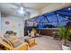 The cozy screened patio includes a hot tub and wicker furniture at 16032 Galiano Ct, Punta Gorda, FL 33955
