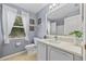 Bathroom featuring white vanity, toilet, tile flooring and white walls at 17396 Cox Ave, Port Charlotte, FL 33948