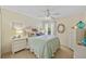 Bedroom with wicker furniture, coastal decor, ceiling fan and carpet flooring at 17396 Cox Ave, Port Charlotte, FL 33948