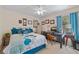 Bedroom with bed, computer desk, side tables and carpet flooring at 17396 Cox Ave, Port Charlotte, FL 33948