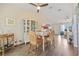 Open dining area featuring stylish furnishings, hardwood floors, and seamless flow into the living spaces at 17396 Cox Ave, Port Charlotte, FL 33948