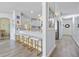 Modern kitchen with sleek countertops, stylish barstools, and open layout perfect for entertaining at 17396 Cox Ave, Port Charlotte, FL 33948