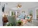 Cozy living room with comfortable seating, a ceiling fan, and plenty of natural light at 17396 Cox Ave, Port Charlotte, FL 33948