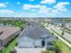 Stunning aerial view of a well-manicured home with a two-car garage in a desirable community at 17629 Palmetto Pass Ln, Punta Gorda, FL 33982