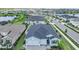 Captivating aerial view of a home with a two-car garage, showcasing its prime location at 17629 Palmetto Pass Ln, Punta Gorda, FL 33982
