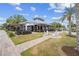 Inviting restaurant with outdoor seating and a lush green lawn area at 17629 Palmetto Pass Ln, Punta Gorda, FL 33982