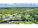 Picturesque aerial view showcasing a waterfront home with private dock, screened-in lanai, and serene canal at 192 Danforth S Dr, Port Charlotte, FL 33980