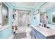 Updated bathroom with a shower-tub combo, vanity, and playful decor at 192 Danforth S Dr, Port Charlotte, FL 33980