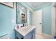 Clean bathroom featuring updated vanity, large mirror, and a crisp, bright ambiance at 192 Danforth S Dr, Port Charlotte, FL 33980