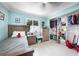 Cozy bedroom with a single bed, dresser, closet with organizers and natural light at 192 Danforth S Dr, Port Charlotte, FL 33980
