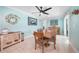 Well-lit dining room with a large table, stylish decor, and access to the outdoors at 192 Danforth S Dr, Port Charlotte, FL 33980