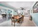 Bright dining area featuring an open layout, tile flooring, and seamless transition to the outdoor patio at 192 Danforth S Dr, Port Charlotte, FL 33980