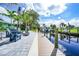 Waterfront patio features a dock, canal views, and outdoor seating at 192 Danforth S Dr, Port Charlotte, FL 33980