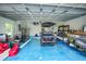 Spacious garage featuring a durable epoxy floor and ample storage for vehicles and equipment at 192 Danforth S Dr, Port Charlotte, FL 33980