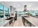Updated kitchen with a large island, modern fixtures, stainless appliances, and an open layout for entertaining at 192 Danforth S Dr, Port Charlotte, FL 33980