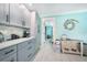 Kitchen pantry and beverage area featuring modern cabinetry and stylish decor elements, located near the dining room at 192 Danforth S Dr, Port Charlotte, FL 33980