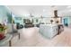Spacious living room boasts an open floor plan with views of the updated kitchen and plenty of seating at 192 Danforth S Dr, Port Charlotte, FL 33980