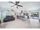 Open concept living room with tile floors, island seating, and an easy transition to the outdoor pool area at 192 Danforth S Dr, Port Charlotte, FL 33980