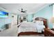 The main bedroom features tile floors, a ceiling fan, and sliding glass doors to the outdoor patio and pool at 192 Danforth S Dr, Port Charlotte, FL 33980