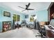 Bright office space with large windows, white tile flooring, and a ceiling fan at 192 Danforth S Dr, Port Charlotte, FL 33980