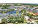 Beautiful aerial view of condos, showcasing the community layout with a central pond and nearby amenities at 206 Gondola Park Dr # 206, Venice, FL 34292