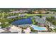 Wide aerial perspective of the residential area, boasting scenic golf courses, ponds, and community pool, a haven for recreation at 206 Gondola Park Dr # 206, Venice, FL 34292