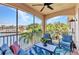 Relaxing screened balcony with comfortable seating and picturesque water views, perfect for enjoying the outdoors at 206 Gondola Park Dr # 206, Venice, FL 34292