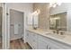 Modern bathroom with dual sinks, white cabinetry, and stylish fixtures at 206 Gondola Park Dr # 206, Venice, FL 34292